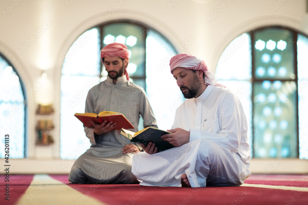 Two Muslims reciting Quran together