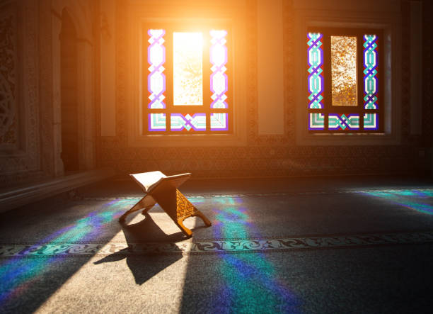 Quran - holy book of Muslims, scene in the mosque at Ramadan time