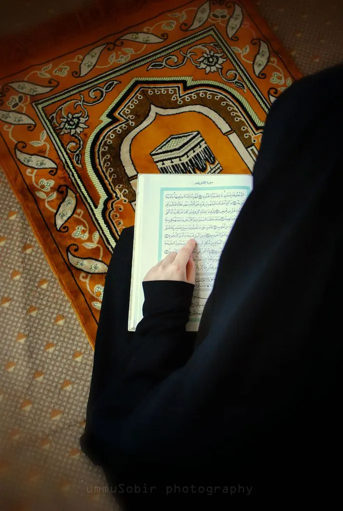 Muslim woman reading Qur'an